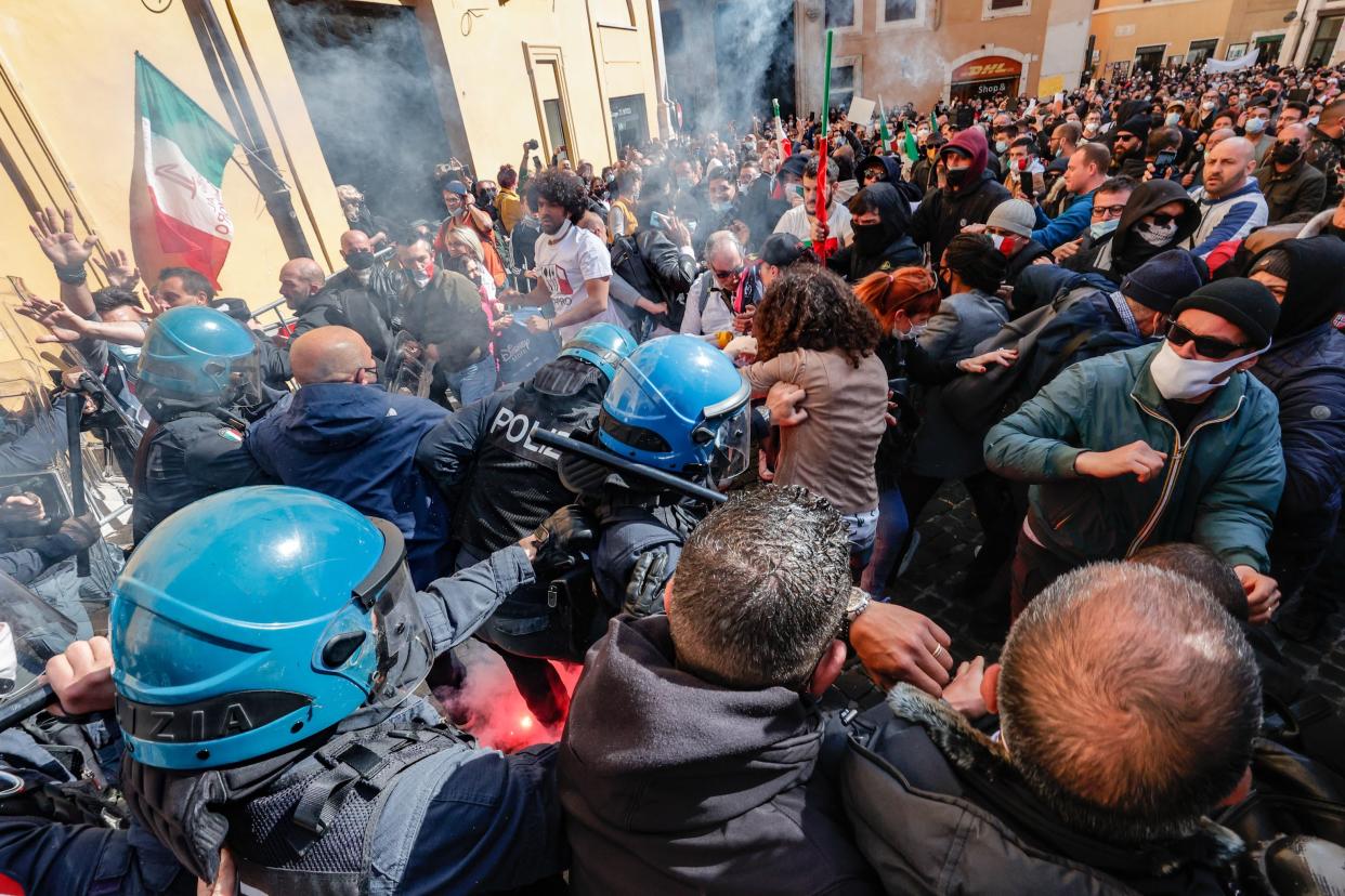  Traders, shopkeepers and restaurateurs clash with police during a protest next to the Chamber of Deputies in Piazza Montecitorio, Rome, Italy, earlier this week (EPA)