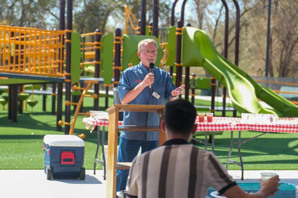 Gene Wells, president of AMBUCS, speaks Thursday at the opening ceremony of the newly built Kylie Hiner Memorial Park in Canyon.