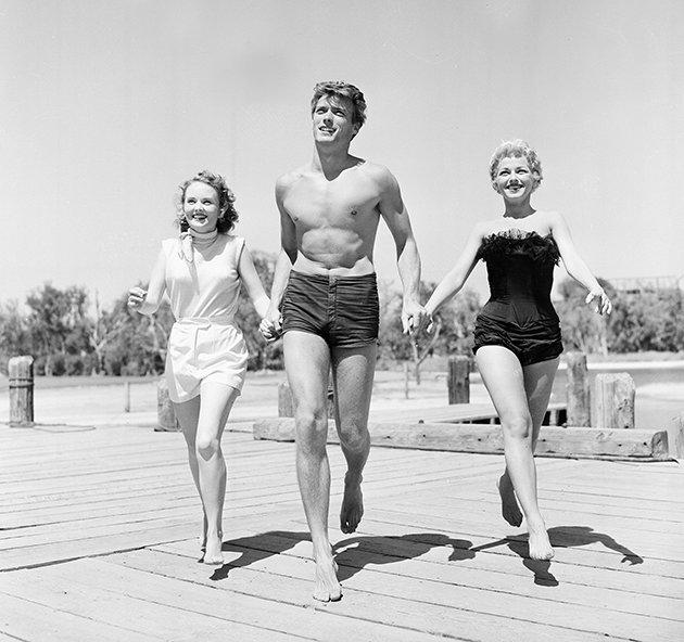 Good genes... Clint back in 1954, with actresses Olive Sturgess and Dani Crayne (Credit: Press Association)