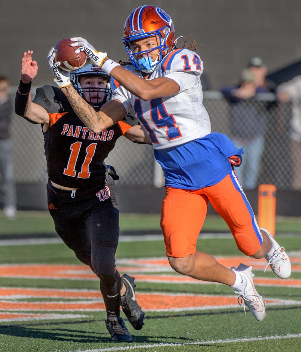 East St. Louis' Rico Bond snags a touchdown reception past Washington's Tyler Brown in the second half of their Class 6A football state semifinal Saturday, Nov. 18, 2023 at Babcook Field in Washington.