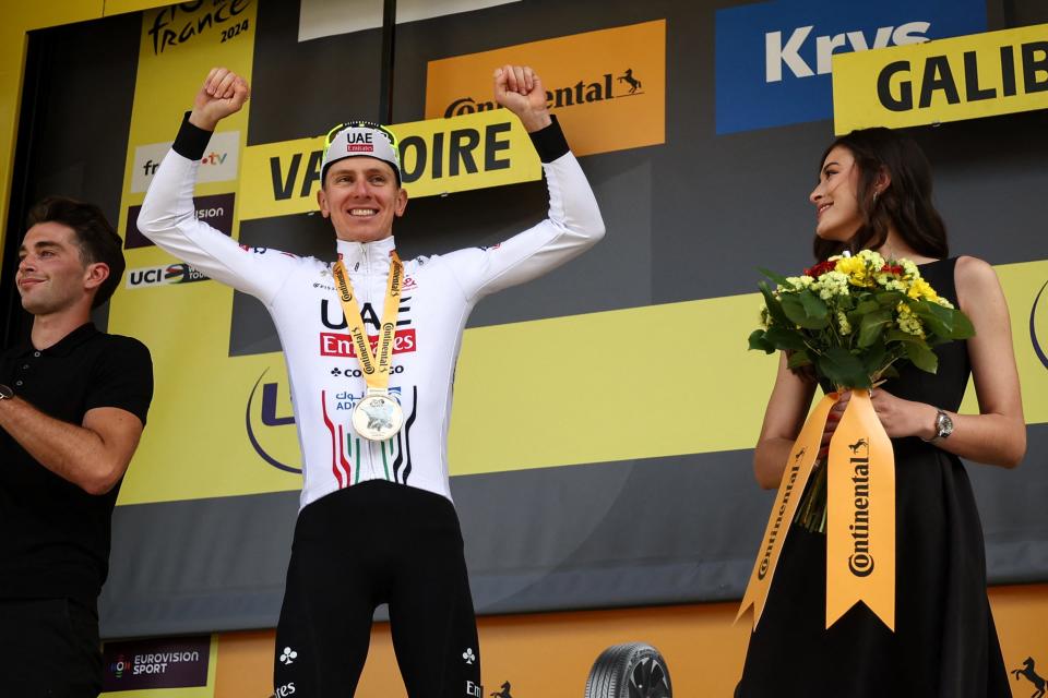 Tadej Pogačar celebrates on the podium after winning the Stage 4 of the 2024 Tour de France on July 2, 2024.