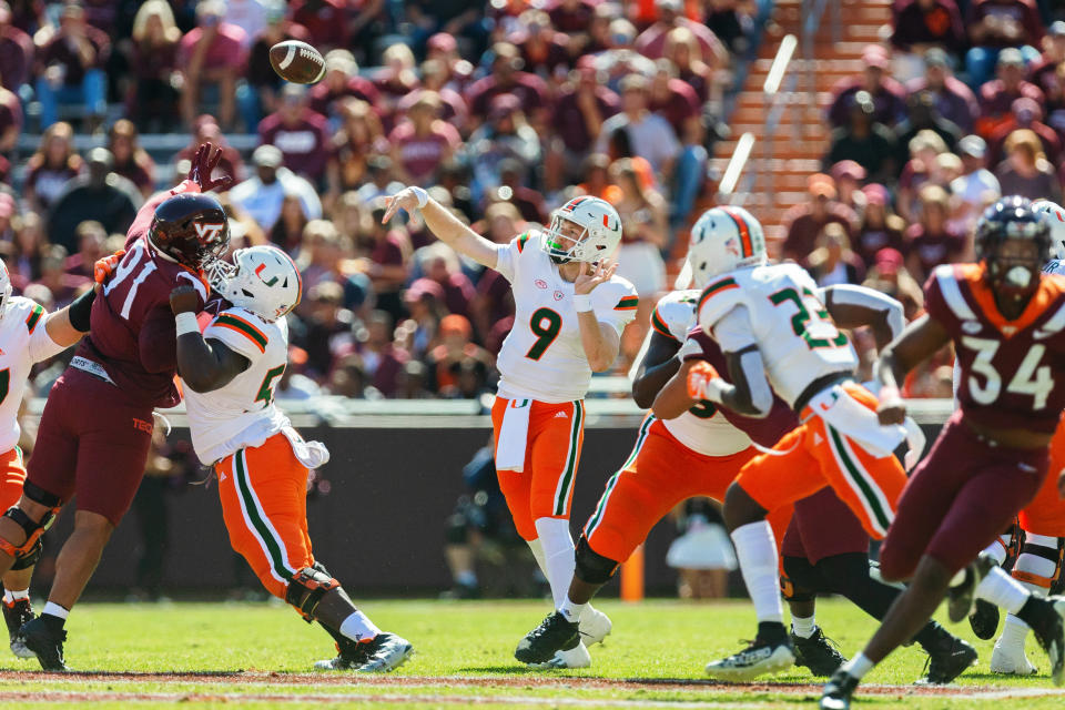 BLACKSBURG, VA - OCTOBER 15: Quarterback Tyler Van Dyke #9 of the Miami Hurricanes throws a pass against the Virginia Tech Hokies at Lane Stadium on October 15, 2022 in Blacksburg, Virginia. (Photo by Ryan Hunt/Getty Images)