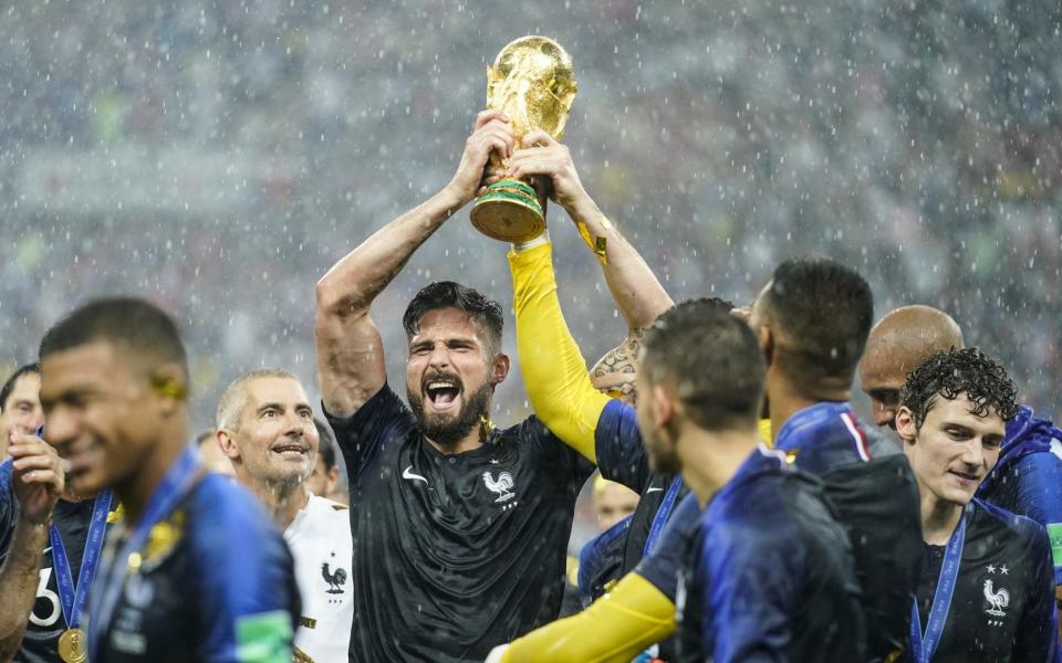 Olivier Giroud lifts the trophy triumphantly - Getty Images Europe