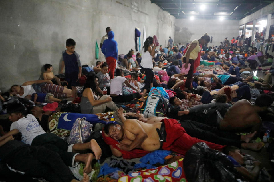 Honduran migrants rest inside a shelter in Tecun Uman.