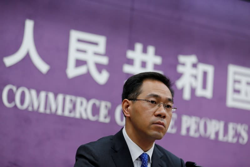 FILE PHOTO: China's Ministry of Commerce spokesperson Gao Feng attends a news conference at the commerce ministry in Beijing