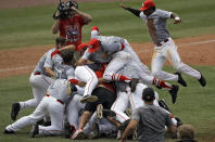 <p>Houston’s Corey Julks (24) dives onto the pile as the team celebrates their win over East Carolina during the American Athletic Conference championship NCAA college baseball game Sunday, May 28, 2017, in Clearwater, Fla. (Photo: Chris O’Meara/AP) </p>