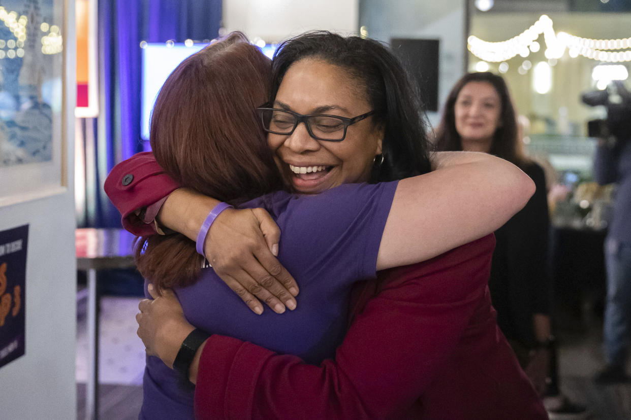 Supporters hug at a watch party for Michigan Proposal 3 at the David Whitney Building in Detroit on Election Day, Tuesday, Nov. 8, 2022. (Ryan Sun/Ann Arbor News via AP)