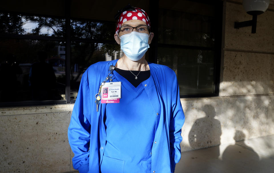 Nurse Teri Wheat poses for a photo in Fort Worth, Texas, Thursday, Nov. 19, 2020. As Wheat recently made her rounds at a Texas maternity ward, she began to realize she was having a hard time understanding the new mothers who were wearing masks due to the coronavirus pandemic. Hearing specialists across the U.S. say they have seen an uptick in visits from people like Wheat, who only realized how much they relied on lip reading and facial expressions when people started wearing masks that cover the nose and mouth. (AP Photo/LM Otero)