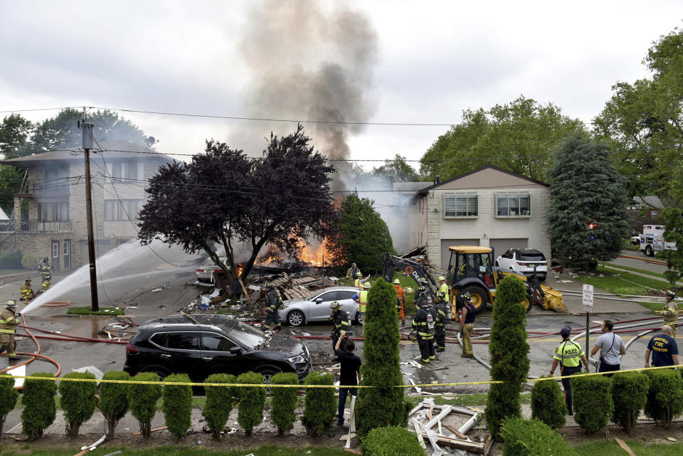 An explosion on Abbott Ave. in Ridgefield, N.J., brought mutual aid from surrounding towns to put out the fire on Monday, June 17, 2019. The lone person inside the residence apparently escaped serious injury. (Tariq Zehawi/The Record via AP)