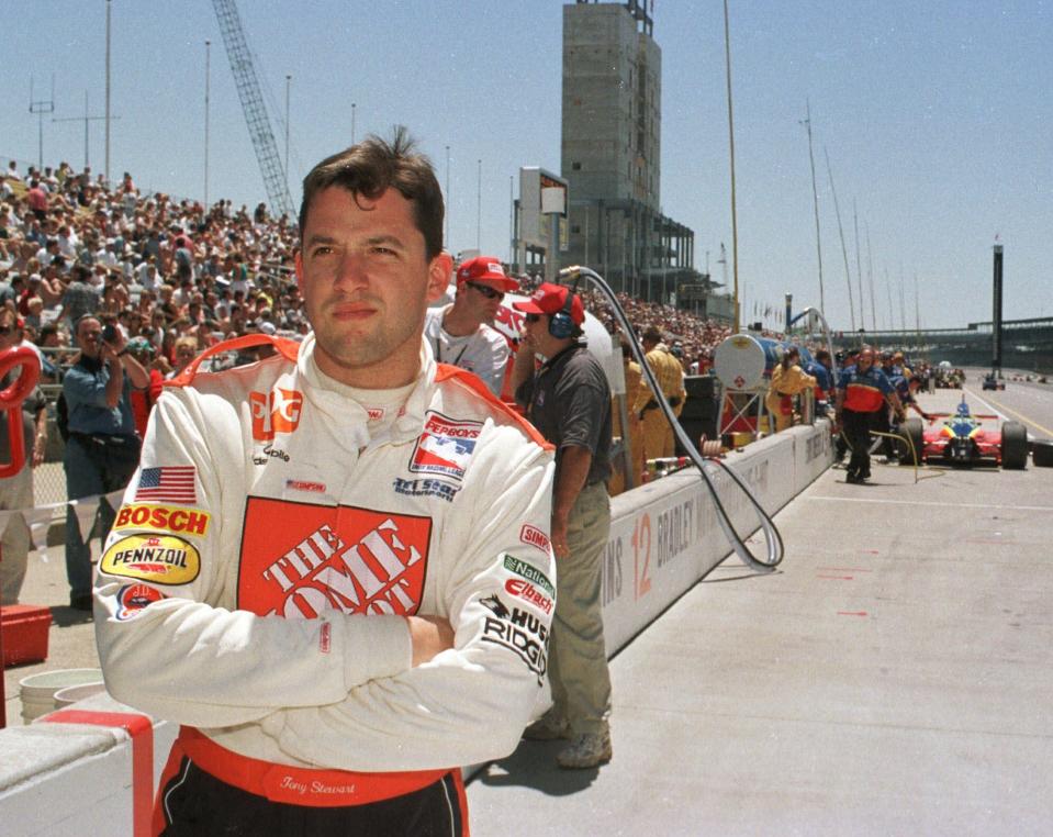 Tony Stewart waited for his car in the pit area of  Indianapolis Motor Speedway on May 27 1999 during the final practice session befor the 83rd Indy 500 the next day. Stewart ran both the IRL Indy 500 and the NASCAR race in Charlotte on the same day. (AP Photo/Tom Strickland)