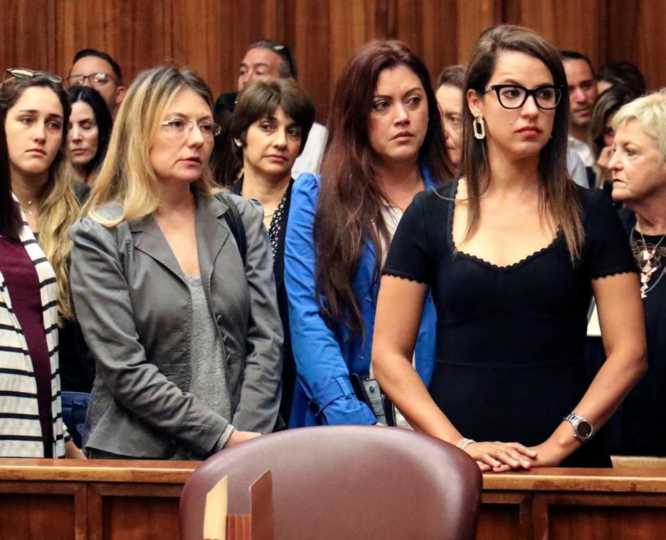 On Wednesday, January 29, 2020 Amir Pelleg’s wife, Zulma Pelleg, right, looks towards Joseph Franco’s family and supporters, a Miami man who was high on ‘whippets’ when he hit and killed Sunny Isles lawyer Amir Pelleg as he walked with his wife down A1A, after Franco pleaded guilty and arrested.