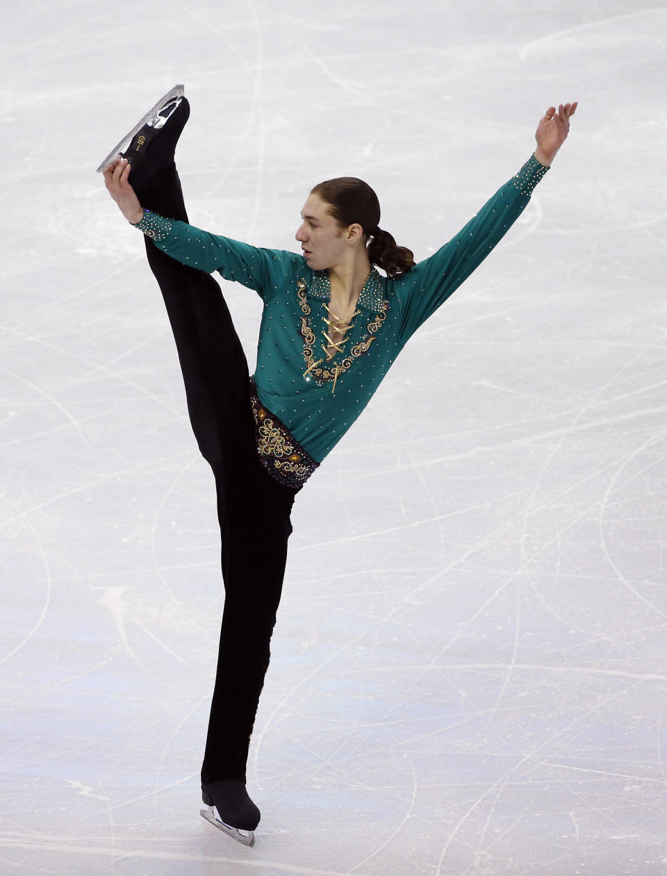 Jason Brown competes in the men's free skate at the U.S. Figure Skating Championships in Boston, Sunday, Jan. 12, 2014. (AP Photo/Elise Amendola)