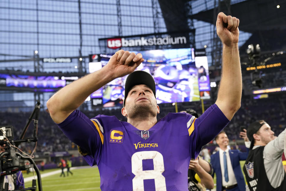 Minnesota Vikings quarterback Kirk Cousins celebrates after an NFL football game against the Indianapolis Colts, Saturday, Dec. 17, 2022, in Minneapolis. The Vikings won 39-36 in overtime. (AP Photo/Abbie Parr)