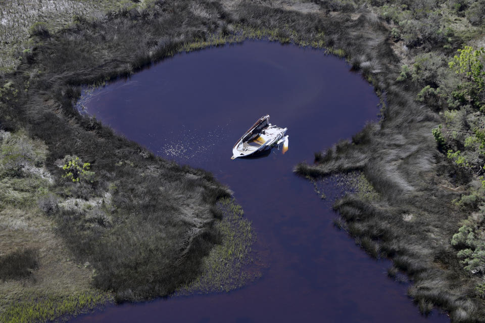 A boat destroyed by Hurricane Michael are shown in this aerial photo Thursday, Oct. 11, 2018, in Mexico Beach, Fla. The devastation inflicted by Hurricane Michael came into focus Thursday with rows upon rows of homes found smashed to pieces, and rescue crews began making their way into the stricken areas in hopes of accounting for hundreds of people who may have stayed behind. (AP Photo/Chris O'Meara)