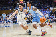 Duke guard Tyrese Proctor (5) guards against North Carolina guard Caleb Love (2) in the first half of an NCAA college basketball game on Saturday, Feb. 4, 2023, in Durham, N.C. (AP Photo/Jacob Kupferman)