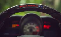 <p>Crank the steering-wheel-mounted mode switch to Race, and the 812 will stick with an even 1.00 g of lateral grip.</p>