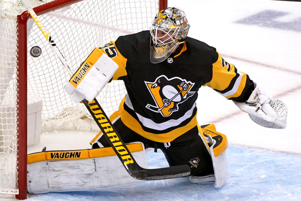 Pittsburgh Penguins goaltender Tristan Jarry allows a goal by New Jersey Devils' Nolan Foote during the third period of an NHL hockey game in Pittsburgh, Tuesday, April 20, 2021. (AP Photo/Gene J. Puskar)