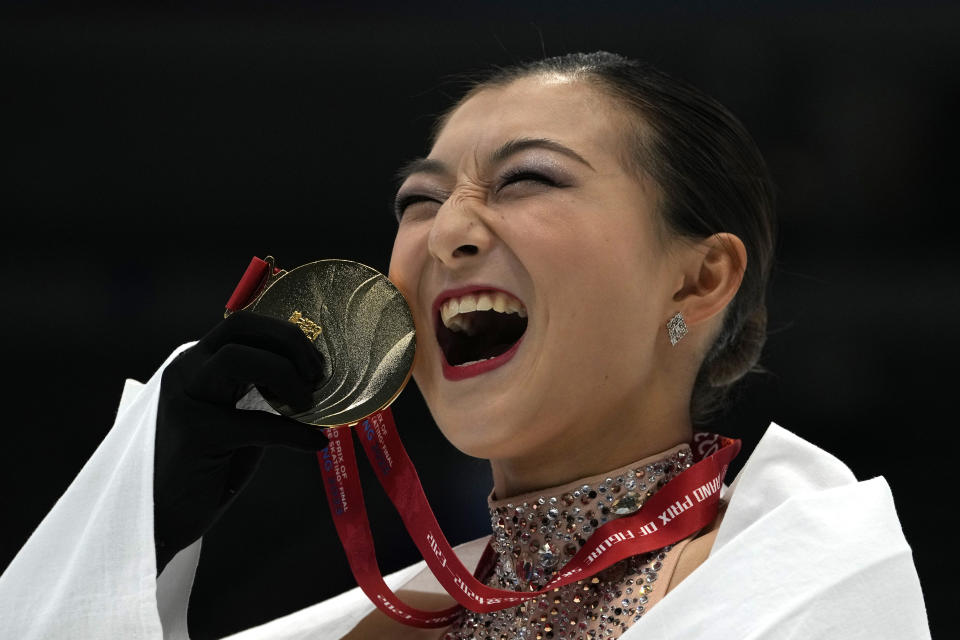 Japan's Kaori Sakamoto poses with her gold medal in the Women's Final for the ISU Grand Prix of Figure Skating Final held in Beijing, Saturday, Dec. 9, 2023. (AP Photo/Ng Han Guan)