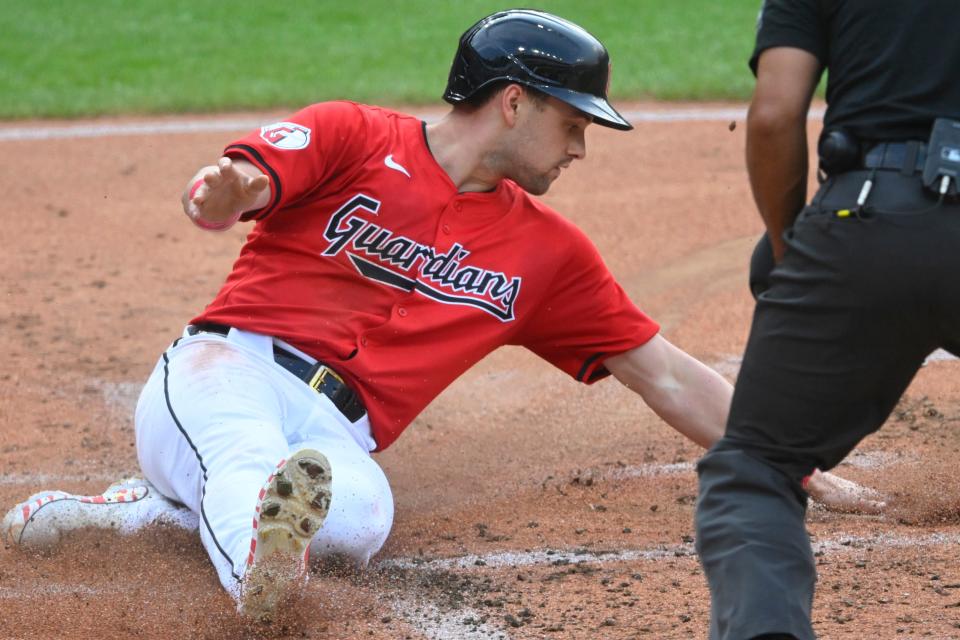 Aug 5, 2024; Cleveland, Ohio, USA; Cleveland Guardians right fielder Lane Thomas (8) scores in the first inning against the Arizona Diamondbacks at Progressive Field. Mandatory Credit: David Richard-USA TODAY Sports