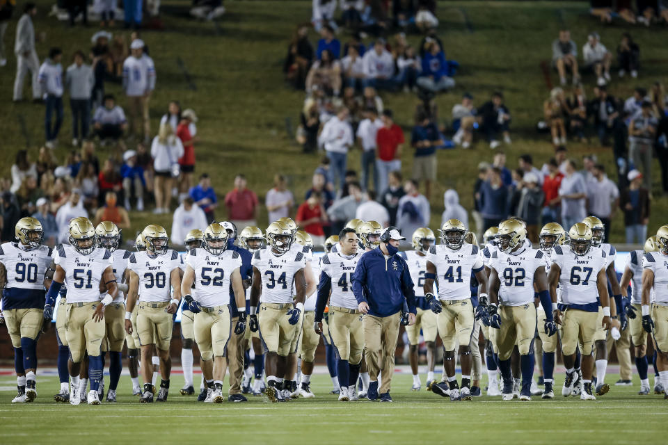 Navy walks from one end of the field to the other between the first and second quarters of an NCAA college football game against SMU, Saturday, Oct. 31, 2020, in Dallas. SMU won 51-37. The American Athletic Conference has postponed the Tulsa at Navy game scheduled for Saturday, Nov. 7 because of positive COVID-19 cases and contact tracing at Navy. The schools and conference made the announcement Thursday, Nov. 5, 2020. (AP Photo/Brandon Wade)