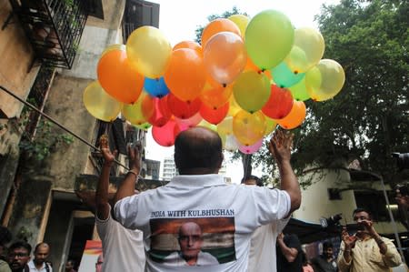 People celebrate after the issue of a verdict in the case of Indian national Kulbhushan Jadhav by International Court of Justice, in Mumbai