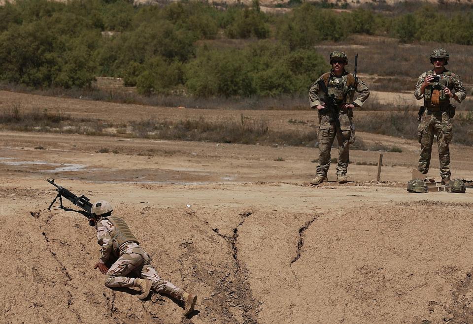 Australian and New Zealand coalition forces participate in a training mission with Iraqi army soldiers at Taji Base, north of Baghdad, Iraq, Wednesday, April 17, 2019. A month after the defeat of the Islamic State group in Syria and Iraq, the U.S.-led international coalition has turned its attention to training Iraqi forces to secure the country against lingering threats posed by IS cells operating in the countryside. (AP Photo/Hadi Mizban)