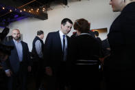 Democratic presidential candidate former South Bend Mayor Pete Buttigieg, center, meets with people at the Nevada Black Legislative Caucus Black History Awards brunch Sunday, Feb. 16, 2020, in Las Vegas. (AP Photo/John Locher)