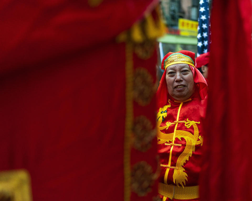 A reveler gets ready to take part during the Chinese New Year "The Dragon" parade in the Chinatown neighborhood of Manhattan, Sunday, Feb. 25, 2024, in New York. (AP Photo/Eduardo Munoz Alvarez)