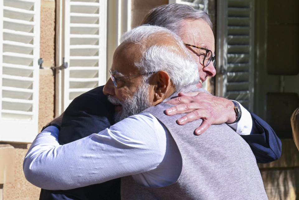 India's Prime Minister Narendra Modi, left is embraced by Australian Prime Minister Anthony Albanese, ahead of a bilateral meeting at Admiralty House in Sydney, Australia, Wednesday, May 24, 2023. Modi is the only leader of the so-called Quad nations to continue with his scheduled visit to Australia after U.S. President Joe Biden pulled out of a planned meeting of the group in Sydney to return to Washington to focus on debt limit talks. (Dean Lewins/Pool Photo via AP)