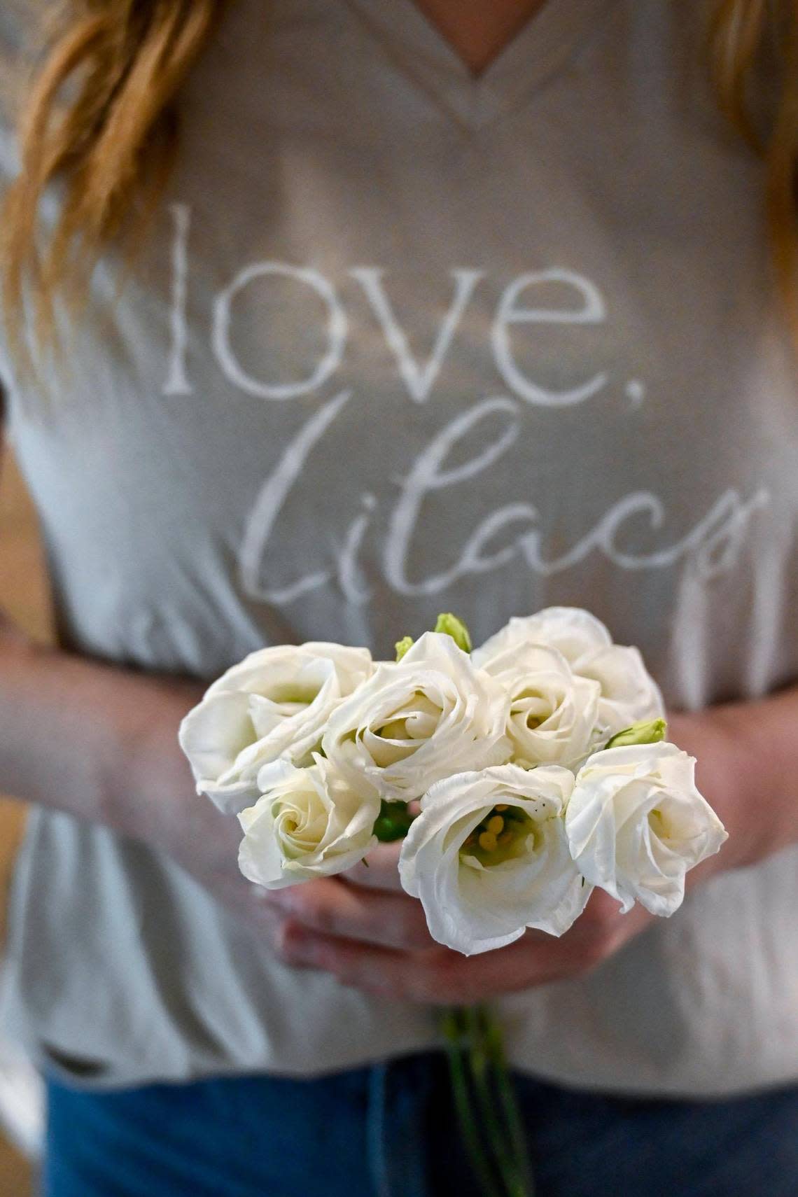 Lexi Nardini, 23, is owner of Love, Lilacs, a wedding floral business in Kansas City’s Crossroads Arts District. Nardini, a University of Missouri graduate, is popular on Tik Tok and Instagram. She displays a few stems of lithianus, a popular flower she uses in her designs.