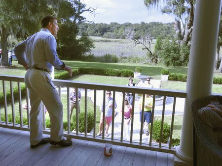 Thomas Ravenel, an independent candidate for the U.S. Senate, makes a campaign speech from the porch of his 19th century house on rural Edisto Island, South Carolina September 13, 2014. When Ravenel made a case for voters choosing him over Republican incumbent Lindsey Graham this month, only a few dozen people showed up at his 19th-century home on a South Carolina island to listen. But millions may end up seeing the speech on national television due to an unusual twist in Ravenel's candidacy - his role on Bravo's "Southern Charm" reality show. The show has raised his profile, drawing an average audience of nearly 1.3 million viewers per episode last spring, and it may give him a wide platform to trumpet his message of limited government, if not in time to help him in the November election. Picture taken September 13, 2014. To match USA-ELECTION/RAVENEL REUTERS/Harriet McLeod (UNITED STATES - Tags: POLITICS ELECTIONS)