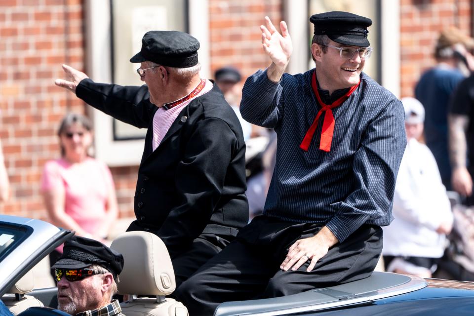 Lt. Gov. Adam Gregg, right, waves from a parade float during Pella Tulip Festival on Friday, May 3, 2024, in Pella.