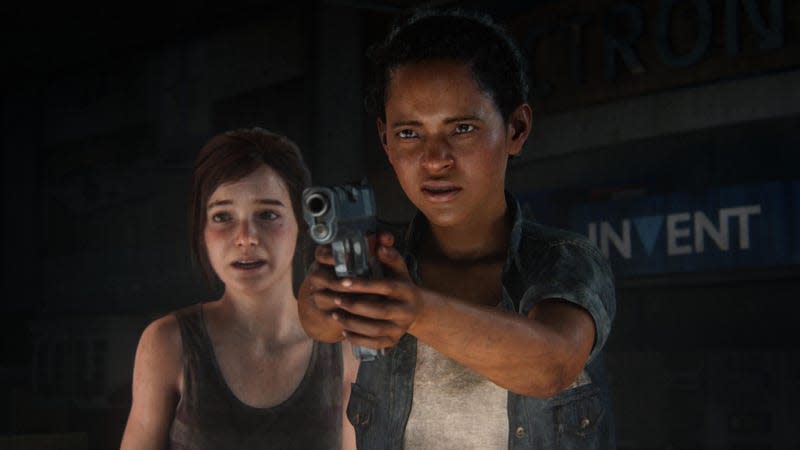 Riley is shown point a gun at something off-screen while Ellie stands behind her with a frightened expression.