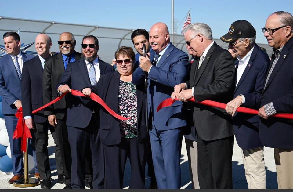 City and agency dignitaries cut the ribbon at the grand opening of Veterans Boulevard Monday, Nov. 20, 2023 in Fresno.