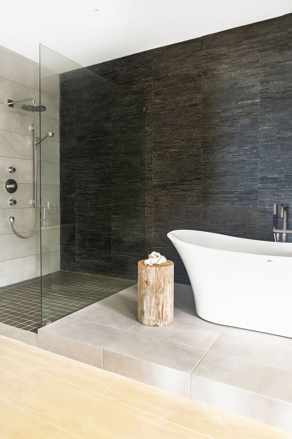 <p>When designing a minimalist and modern bathroom, stick neutral tones but keep things exciting and varied by layering tiles of different materials for different sections in the space, as <a href="http://www.ishkadesigns.com/" rel="nofollow noopener" target="_blank" data-ylk="slk:Ishka Designs;elm:context_link;itc:0;sec:content-canvas" class="link ">Ishka Designs</a> did in this luxe, nature-inspired bathroom.</p>