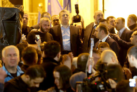 Georgian Prime Minister Giorgi Kvirikashvili waits for protestors to let him make a statement during a rally in front of the parliament building in Tbilisi, Georgia, May 31, 2018. REUTERS/Irakli Gedenidze