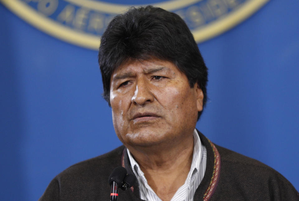 Bolivia's President Evo Morales speaks during a press conference at the military airport in El Alto, Bolivia, Saturday, Nov. 9, 2019. Police in three of the most important cities of Bolivia retreated to their barracks asking for the resignation of Morales, who stressed “a coup d'etat in process” and called for a dialogue with the opposition to pacify the country after weeks of protests against the results of the presidential elections. (AP Photo/Juan Karita)