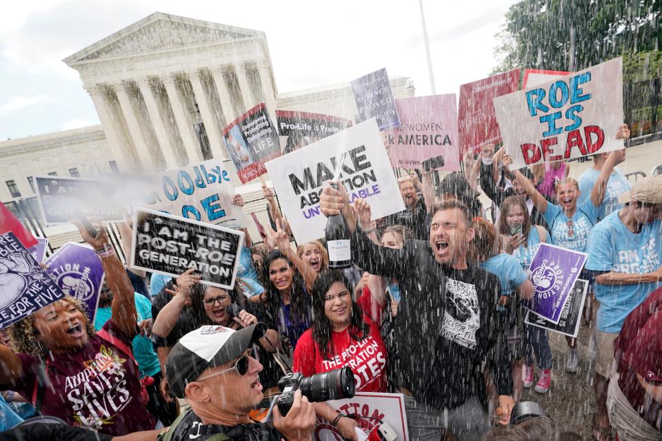 A celebration outside the Supreme Court, Friday, June 24, 2022, in Washington. The Supreme Court has ended constitutional protections for abortion that had been in place nearly 50 years, a decision by its conservative majority to overturn the court's landmark abortion cases.