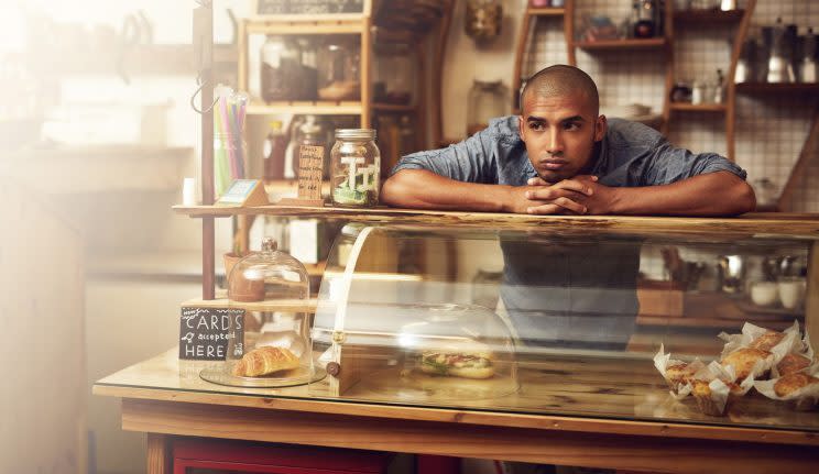 Coffee house barista looking bored (Getty Images)