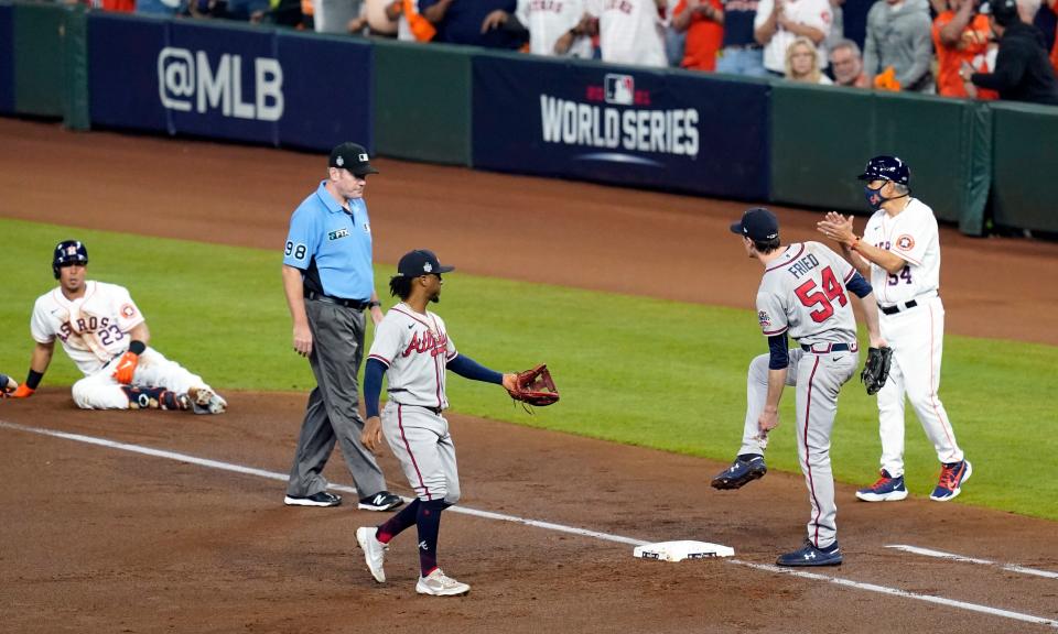 Braves starting pitcher Max Fried (54) reacts after being spiked by Astros left fielder Michael Brantley (23) during the first inning.