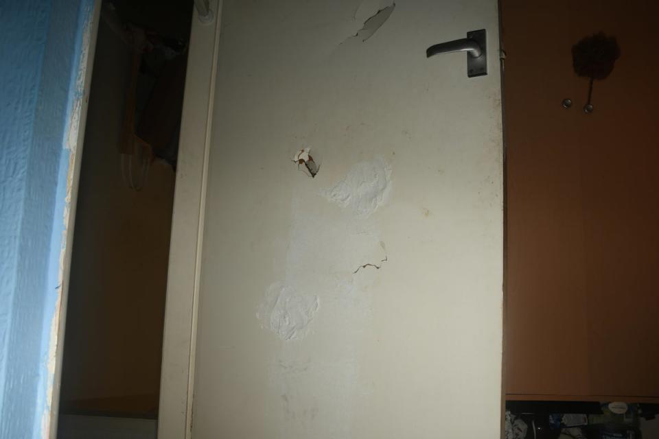 Damage to a door in the family home (PA)