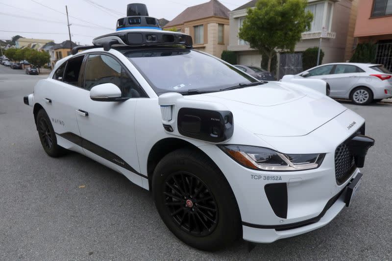 FILE PHOTO: A Waymo Jaguar I-Pace SUV is seen driving on a road in San Francisco