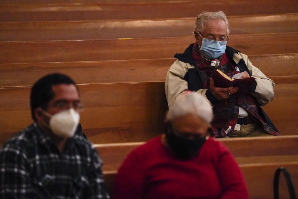 Worshipers gather for a Christmas Eve Mass inside the Cathedral of Our Lady of the Angels, Thursday, Dec 24, 2020, in Los Angeles. California became the first state to record 2 million confirmed coronavirus cases, reaching the milestone on Christmas Eve as nearly the entire state was under a strict stay-at-home order and hospitals were flooded with the largest crush of cases since the pandemic began. (AP Photo/Ashley Landis)