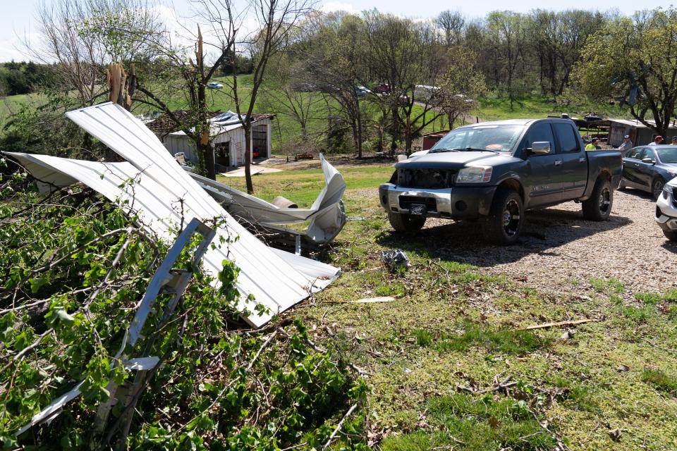 Large debris from sheds and garage at the residence of Ethan and Ashley Steenback after an early Tuesday tornado in Overbrook.