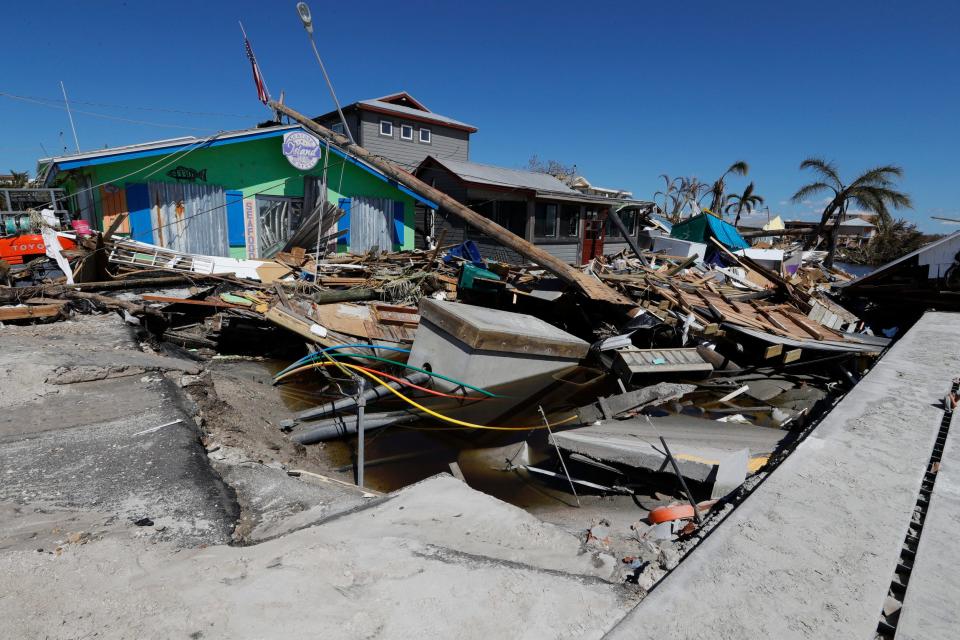 Debris is scattered throughout what remains of Pine Island Road in Matlacha, Sunday October 02, 2022, after the impact of Hurricane Ian.