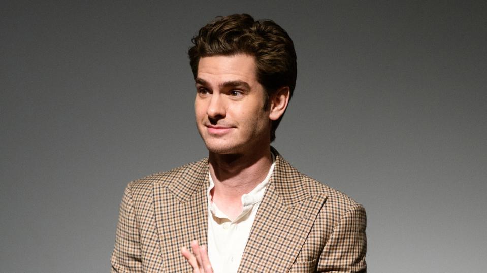 Andrew Garfield waves