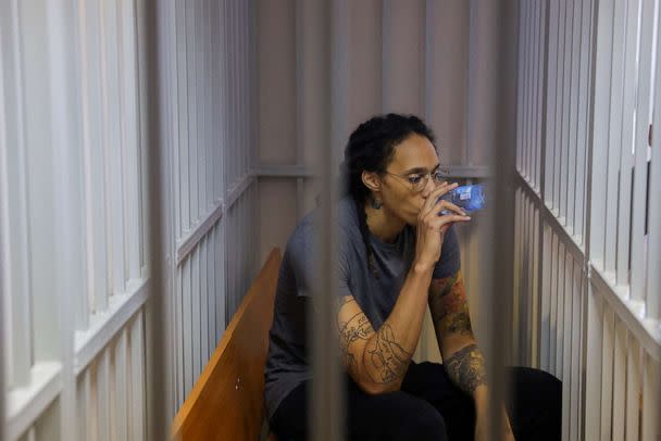 PHOTO: Basketball player Brittney Griner, who was detained at Moscow's Sheremetyevo airport and later charged with illegal possession of cannabis, drinks water inside a defendants' cage after the court's verdict in Khimki outside Moscow, Aug. 4, 2022. (Evgenia Novozhenina/Reuters, FILE)