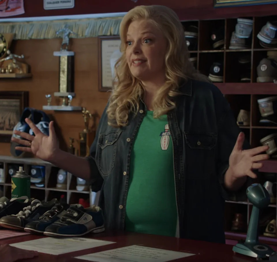 Brenda behind the counter at the bowling alley