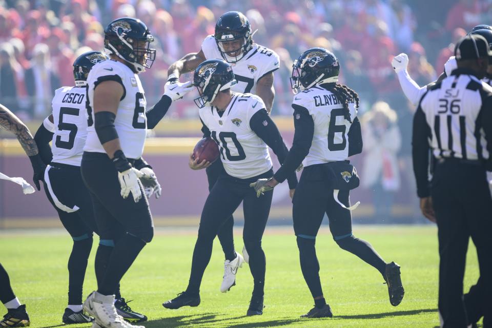 Jacksonville Jaguars place kicker Riley Patterson (10) and teammates celebrate after he recovered an onside kick to start the the first half of an NFL football game against the Kansas City Chiefs, Sunday, Nov. 13, 2022 in Kansas City, Mo. (AP Photo/Reed Hoffmann)