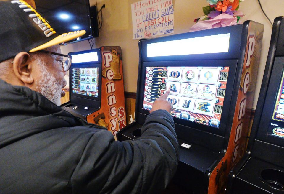 Hank Copeland, 72, points out a bonus roll while playing a Pennsylvania Skill game inside American Legion Post 771 in Erie on Feb. 28. Copeland was up $15 at the time.